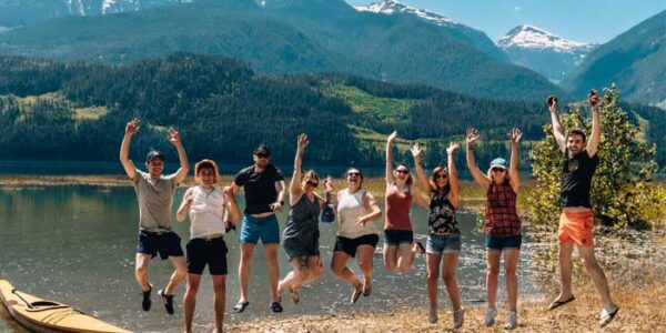 Lake Revelstoke - a lovely group pose with our guests | Moose Travel Network | Canadian Rocky Mountain Tour