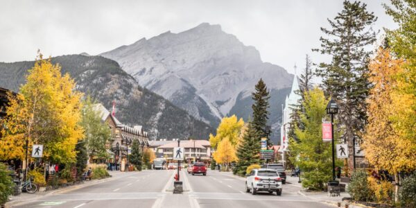 Banff Avenue leading to Cascade Mountain with local shops and historic buildings lining the street