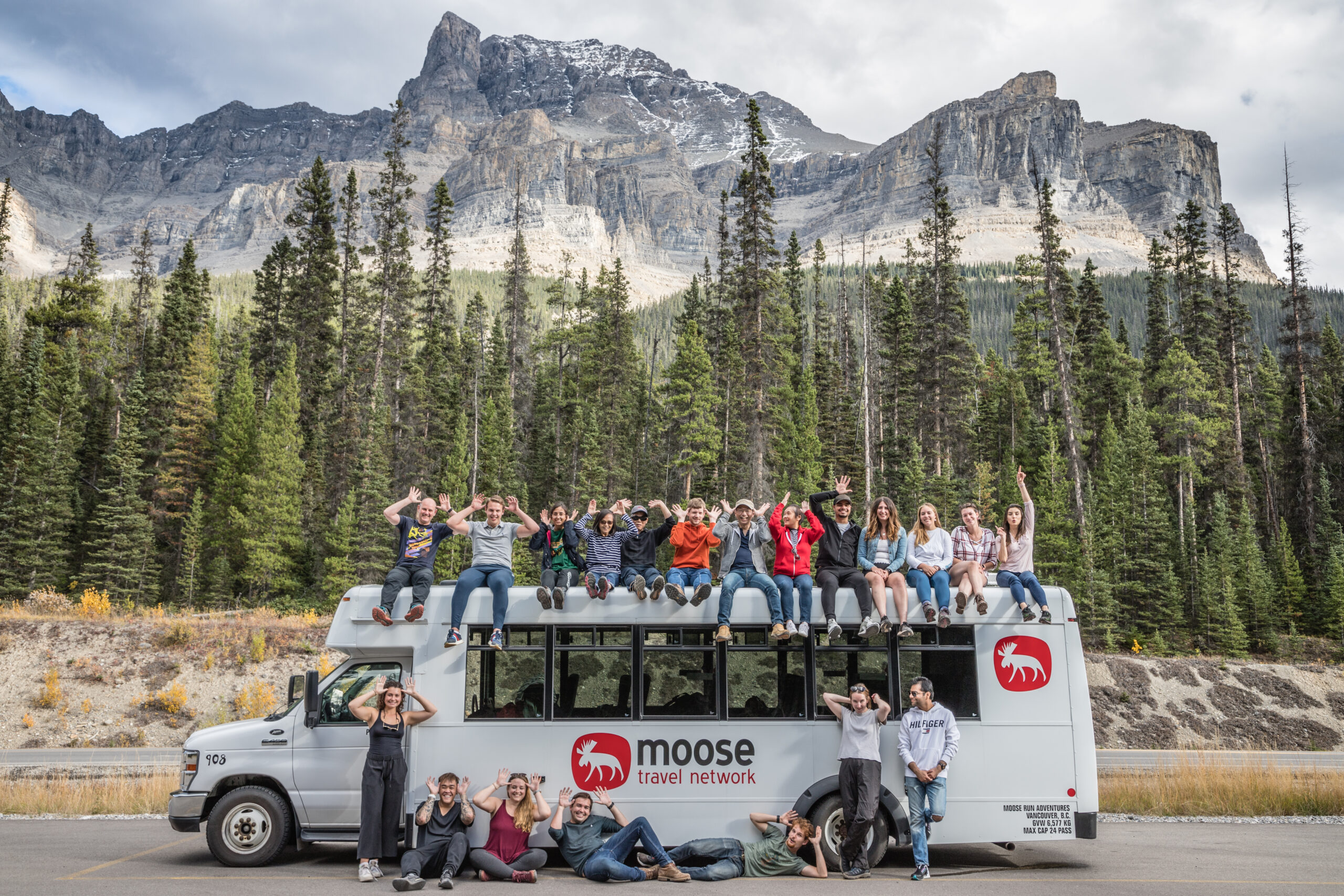 Group photo with passengers imitating a Moose with their hands